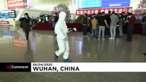 People board trains and planes out of Wuhan for first time in 11 weeks