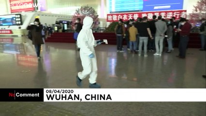 People board trains and planes out of Wuhan for first time in 11 weeks