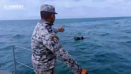 Thai Navy rescue four fishermen floating in the sea after boat capsizes