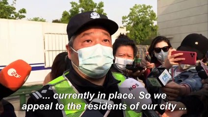 Wuhan Police appeal to residents not to leave for non-essential travel as city lifts travel ban