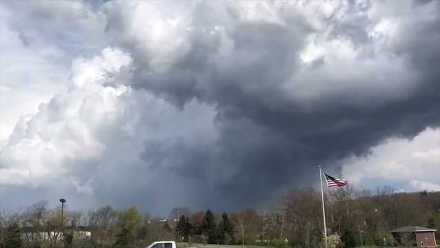 Tornado sirens wail in the distance