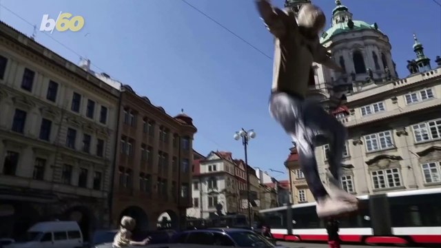 Prague Residents Under Lockdown Treated to Bizarre Sight of Acrobats Bouncing on Trampoline Pulled by Truck!