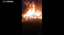 Greek migrant camp is set alight as clashes shake Chios island