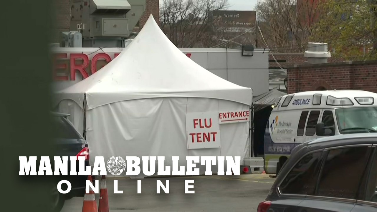 Workers set up refrigerated trailer outside New York hospital
