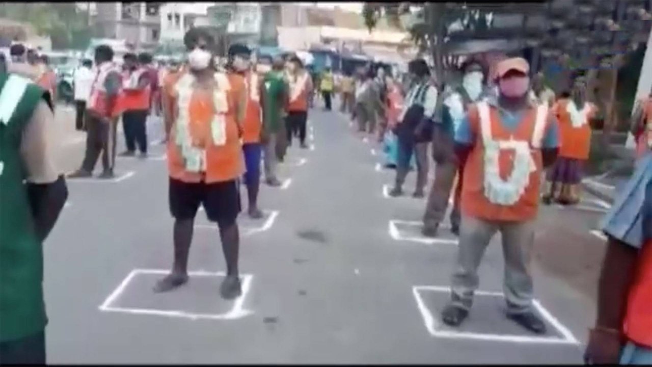 Sanitation workers honoured with Currency Notes Garlands