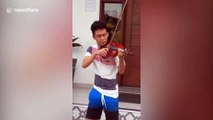 Talented student stranded at airport plays violin at hotel