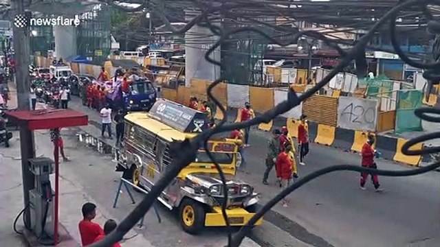 Catholic devotees in the Philippines defy COVID-19 lockdown to carry Jesus Christ statue through streets