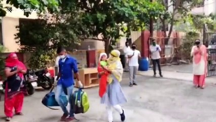 Six-month-old baby who beat COVID-19 receives applause from neighbours in India