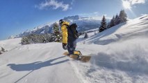 Snowboarder Smoothly Glides on Snow-Covered Mountain