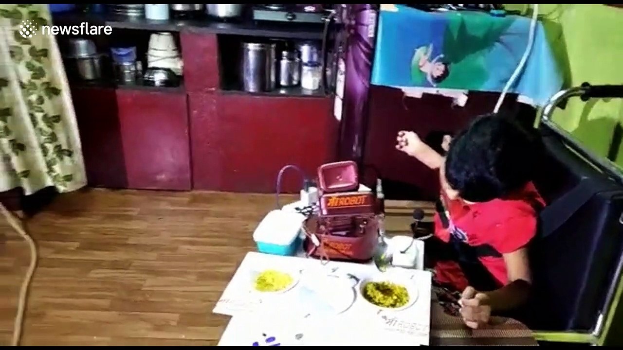 School dropout father in India builds robot to help feed his daughter with cerebral palsy