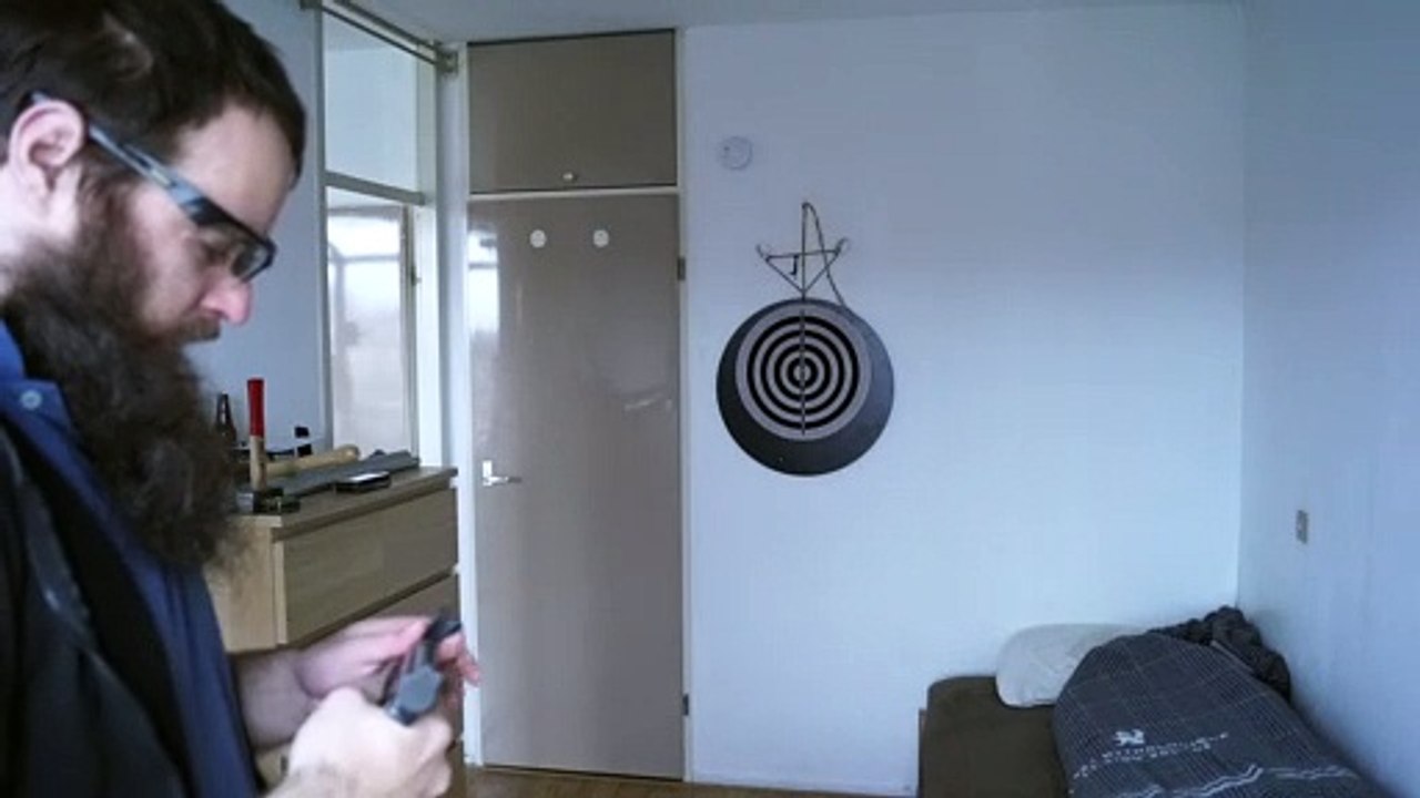 Air gun shooting against a target, with an indoor-outdoor air gun