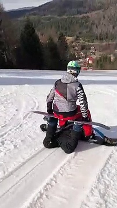 Buddies Show Off a Funky Snowboarding Trick