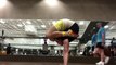 Guy Wearing Funny Socks Contorts His Body While Doing Handstand