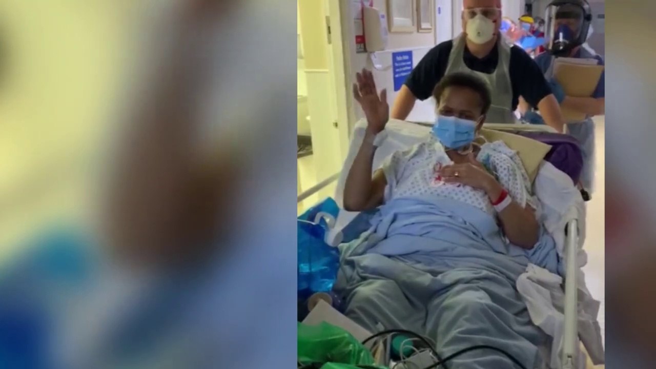 Nurse Millie Magadlela is cheered out of intensive care after winning her battle with coronavirus