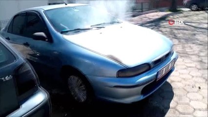 Kova ve şişe ile otomobili kül olmaktan kurtardılar