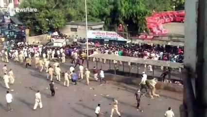 Indian police break up migrant worker demonstration outside train station during COVID-19 lockdown