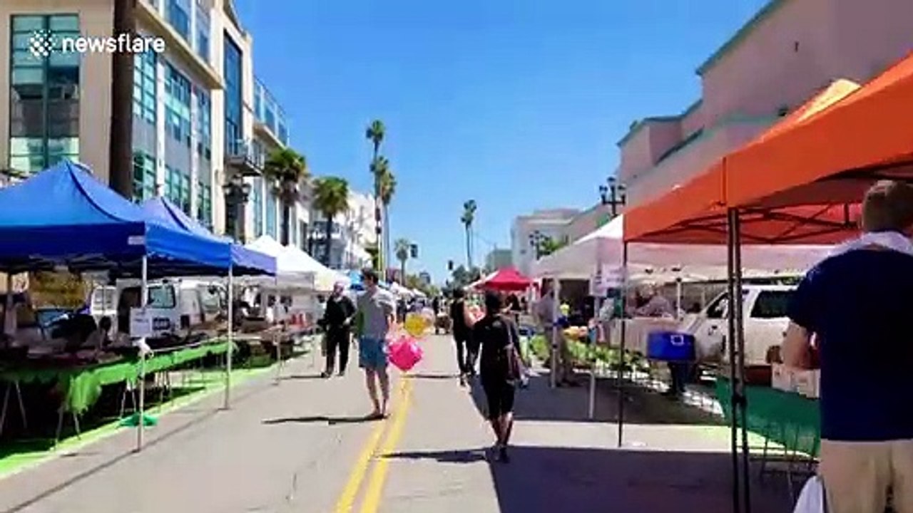 Bustling Los Angeles farmers market is socially distant with mandatory masks amid coronavirus crackdown