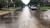 Street turns into a small creek amid flooding