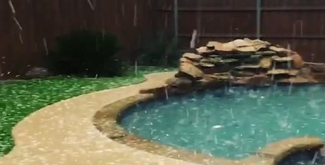Heavy hail accumulates on the ground