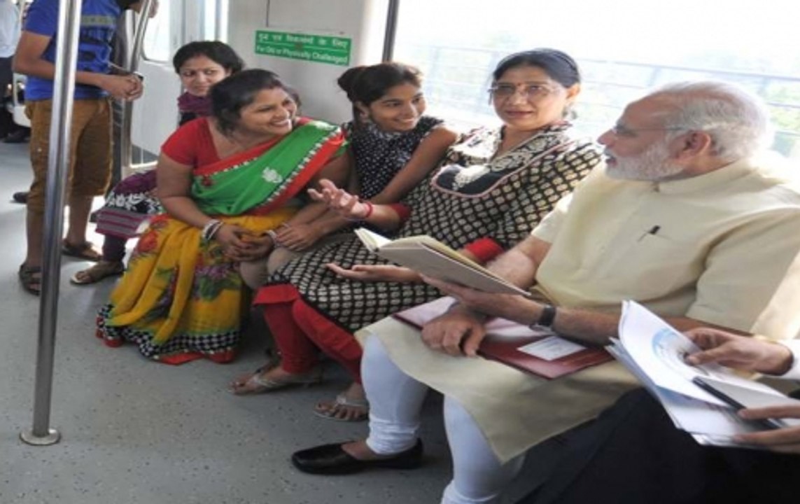 Selfies and smiles: PM Modi gets a rousing welcome at Delhi Metro