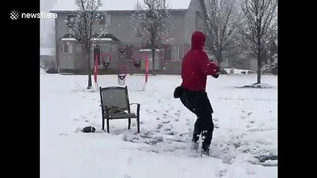 Despite coronavirus shutting down school and practice, high school quarterback continues to train in the Michigan snow
