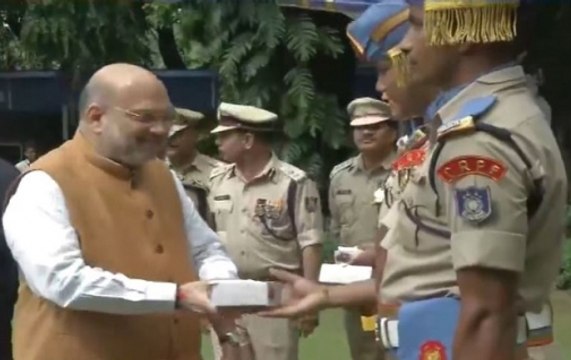 New Delhi: Home Minister Amit Shah hoists Tricolour at his residence