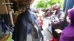 Activist dressed as Batman hands out free face masks during COVID-19 pandemic in Indonesia