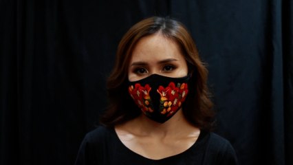 Vietnamese designer embroiders face masks to encourage people to cover up for Covid-19 fight