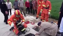Chinese fireman hangs upside down to save toddler trapped in deep well