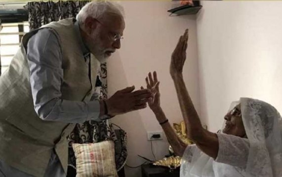 PM Narendra Modi meets his mother Heeraben before casting his vote