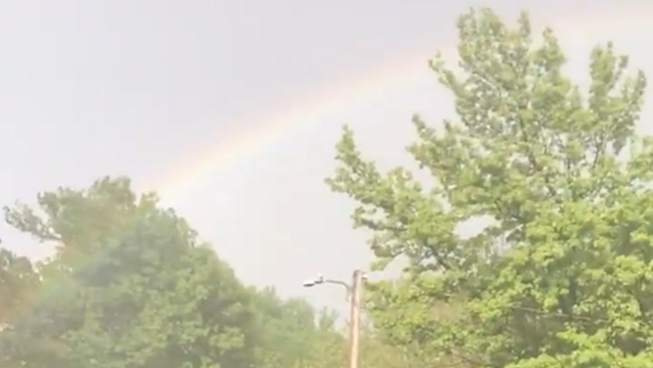Beautiful rainbow emerges from hail