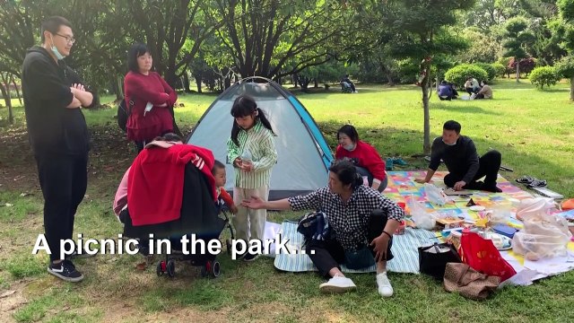 Flickers of joy in China's virus ground zero mask deep fears