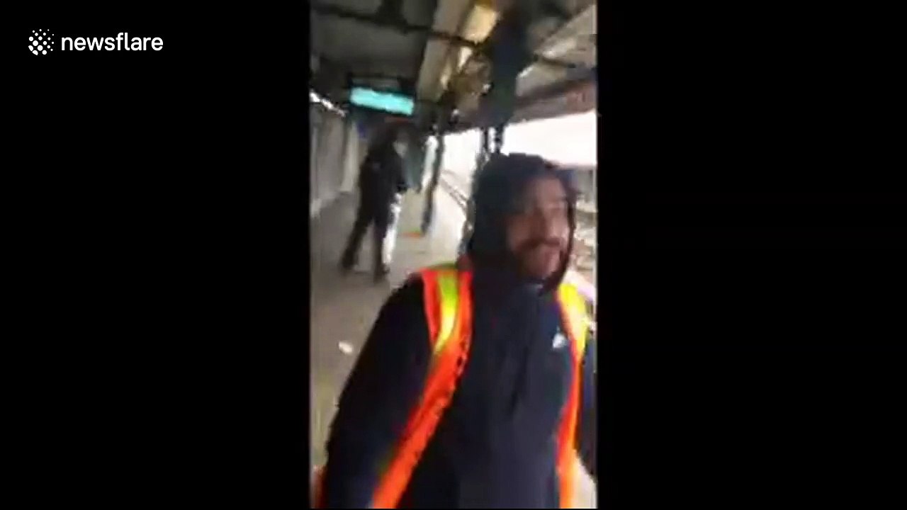 Shocking moment MTA worker attacks passenger after being caught spitting on the tracks