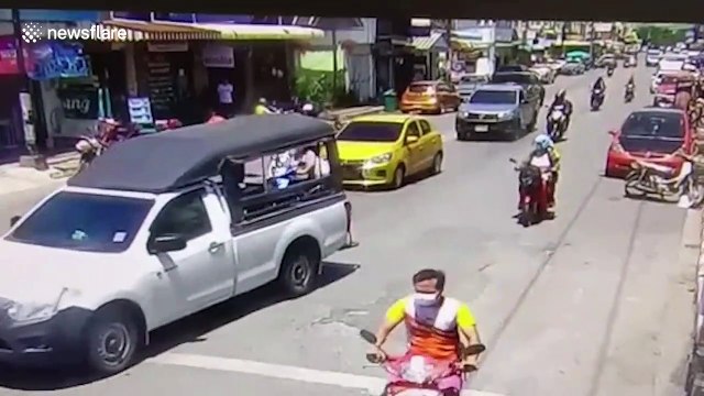 Runaway Thai driver drags policeman on car bonnet for over a mile to avoid being checked