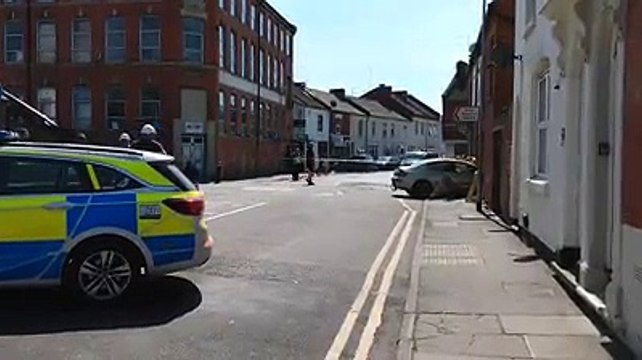 Northampton Police remove a crashed car from the wall of Wolfie's Cafe in Earl street