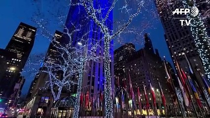 New York's Rockefeller Center glows blue in support of essential workers