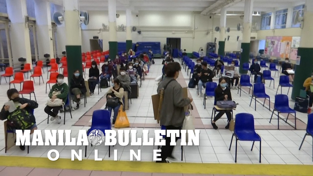 Temperature checks and masks as Hong Kong students sit delayed exams