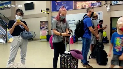 Indonesia sends foreign nationals home to curb spread of coronavirus