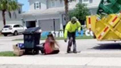 Sanitation Worker Gets A Kick Out Of Trash Bag Prank