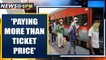 Migrants taking train to Bihar from Surat say 'paid more than ticket price' | Oneindia News