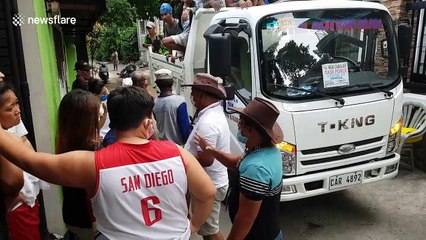 Free bags of rice handed out to residents struggling from Covid-19 downturn in the Philippines