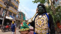 Indian man dresses as death god to remind people to stay home amid coronavirus pandemic