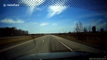 Driver narrowly avoids smashed windscreen from flying debris in Canada