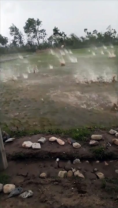 Huge Hail Landing in Flooded Field
