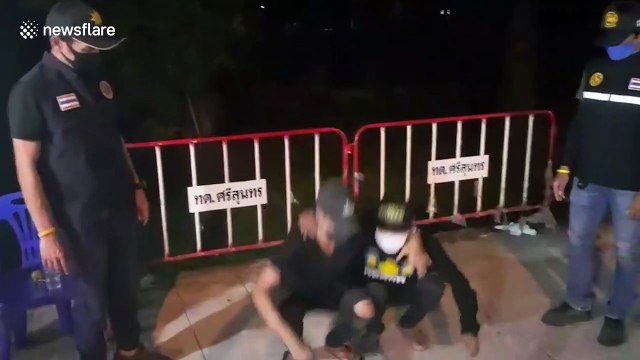 Coronavirus curfew violators forced to do squats on Thai roadside