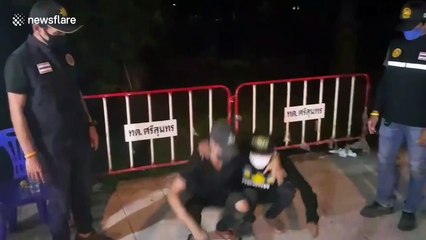 Coronavirus curfew violators forced to do squats on Thai roadside