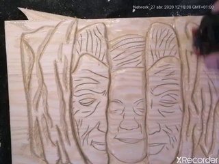 Wood carving face in wood