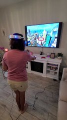 Woman Struggles Playing VR Game