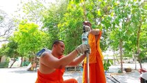 Buddhist monks in Thailand build foot-pedal dispenser for hand sanitiser amid COVID-19 pandemic
