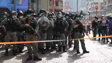 Hong Kong riot police patrols the street after online call for protest action on Labour Day